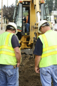 workers inspecting soil quality