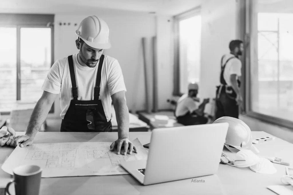 Atlanta analyzing floor design in laptop